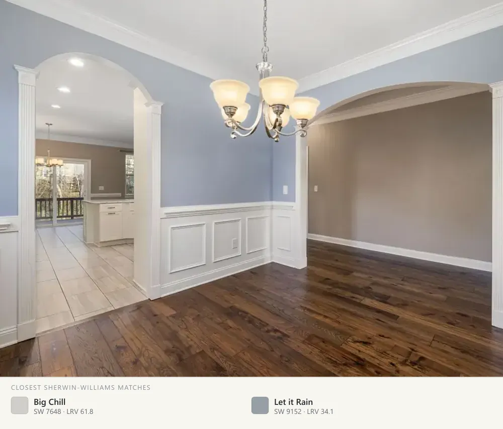Blue-gray dining room with wainscot