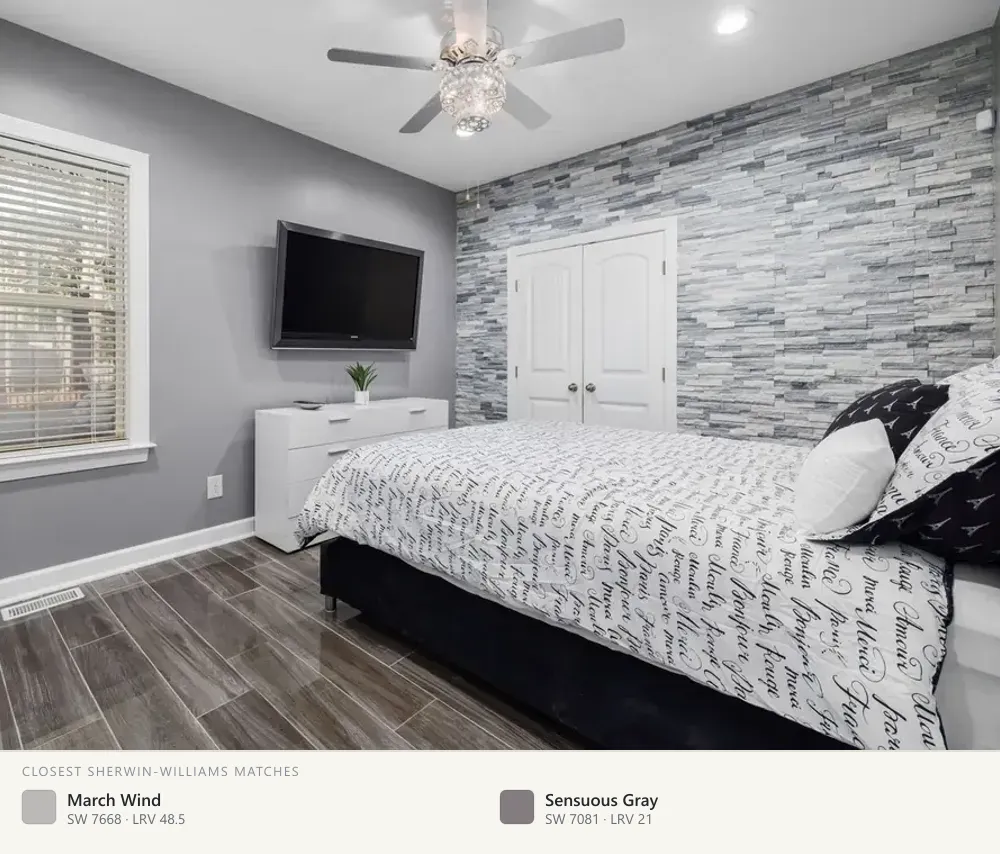 Gray bedroom with a stone accent